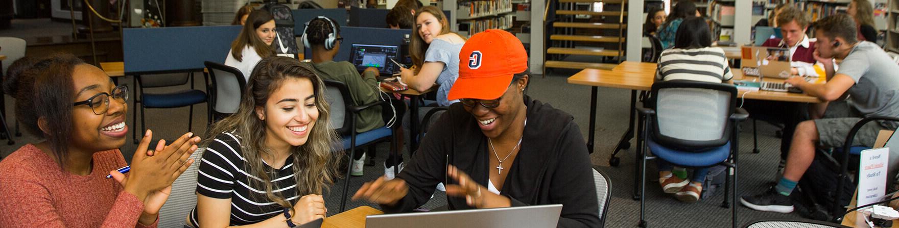 Admissions Upper School students working together in library